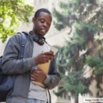 Black College Student Holding Phone