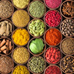 Colored spice background. Spices and herbs top view