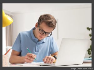 Student Doing Homework with Laptop
