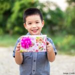Child Holding Gift
