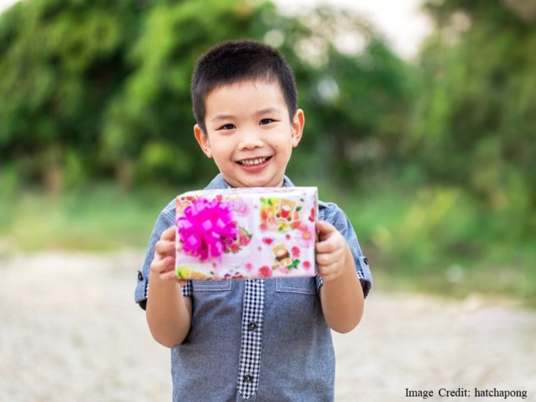 Child Holding Gift