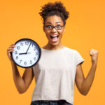 Student Holding Clock