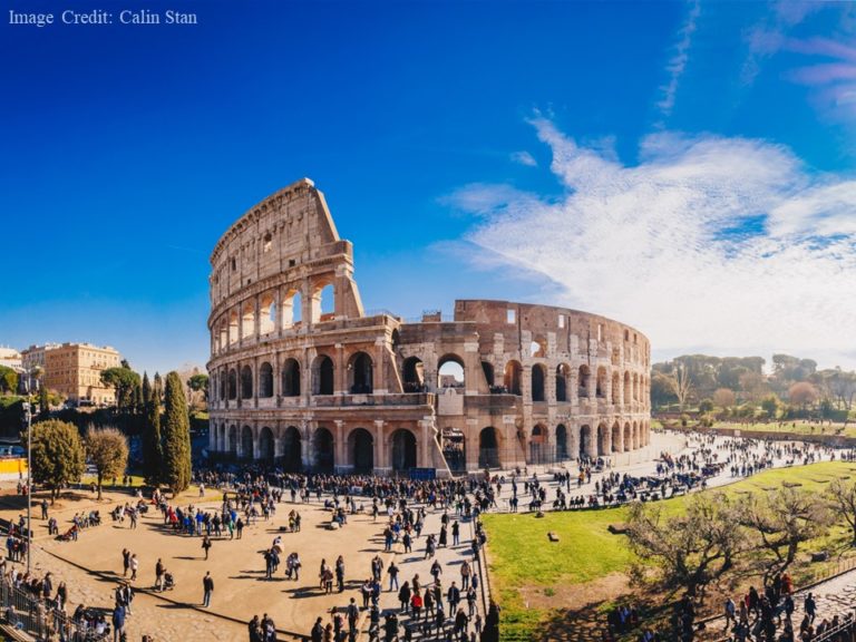 The Roman Coloseum on a sunny day, with lots of people in view