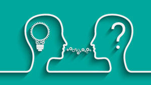 A graphic of two heads facing each other in conversation: one with a lightbulb inside, the other with a question mark.