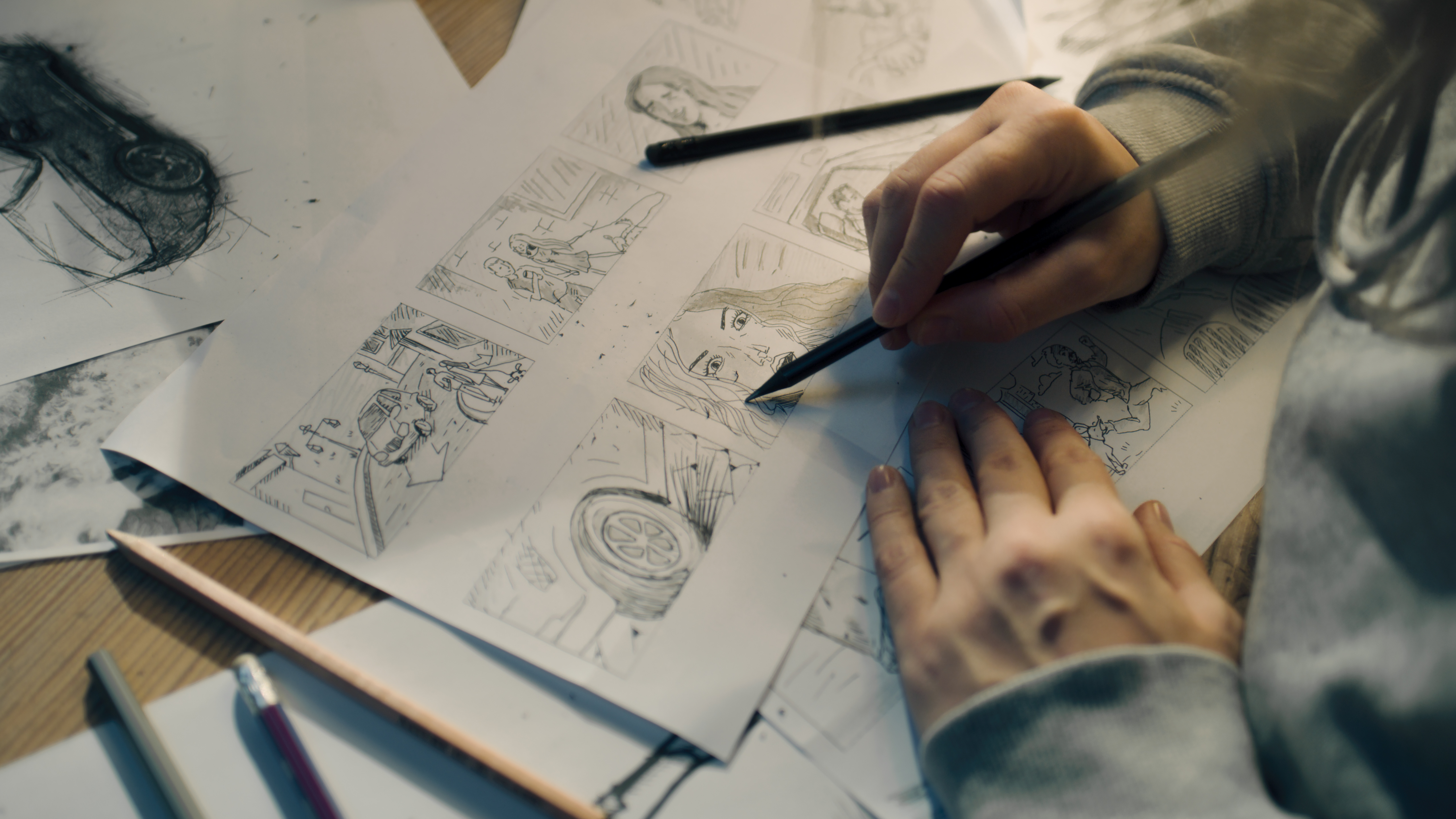 Young woman draws an animated storyboard