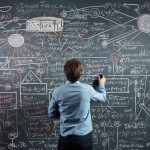 mathematics professor solving complex equations on a blackboard