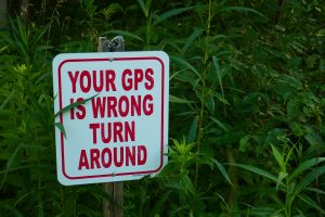 A sign reading "Your GPS is wrong; turn around."